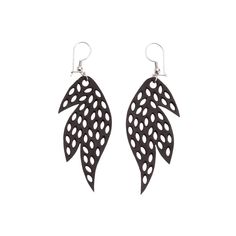 two pairs of black and white laser cut earrings with leaves hanging from the back,