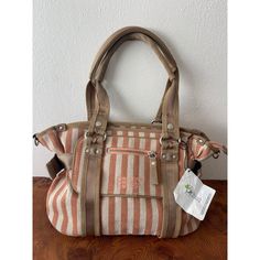 Unique And Vintage George Gina & Lucy Handbag In Like New Condition. Beautiful Peach And Off White Stripes Cotton Purse With Beige Or Tan Canvas Straps And Edge. Silver Metal Accents And Zippers. Front Pocket With Zipper. Inner Pocket With Zipper And Two Open Pockets On The Other Side. Two Adjustable Side Canvas Straps. Nwt Original Price $173.00. This Bag Is Missing A Shoulder Strap And The Key Chain Which Is Reflected In The Price. Approximate Measurements: 10" Tall 17" Wide 6.5" Deep Retro Beige Bags With Large Capacity, Beige Retro Bags With Large Capacity, Large Capacity Retro Beige Bag, Vintage Beige Hobo Bag, Vintage Beige Satchel Hobo Bag, Retro Beige Satchel With Large Capacity, Beige Hobo Bag Satchel For Travel, Beige Satchel Hobo Bag For Travel, Large Capacity Retro Beige Canvas Bag