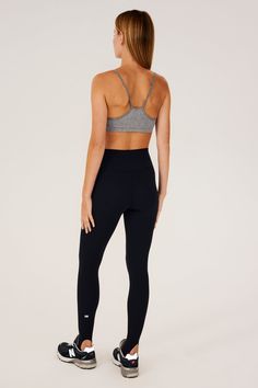 Our famous, form fitting high waist legging redesigned as a stirrup tight. Our ultra luxe Airweight fabric has a supremely soft hand and second skin comfort. BEST FOR: hot yoga, barre, Pilates. Model is 5'10" and wears a size small. Sleek Yoga Activewear With Built-in Bra, High Waist Yoga Activewear With Built-in Bra, High Stretch Leggings With Built-in Bra For Yoga, Full Length Tights With Light Support For Pilates, Full Length Light Support Tights For Pilates, Sleek Activewear With Built-in Bra For Sports, Compression Black Bottoms For Barre, Athleisure Yoga Pants For Barre, Sleek Tight Activewear For Gym