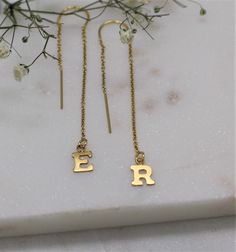 "Get personal with this letter threader earring in 14 carat gold filled or sterling silver. Get one or Buy 2 of the same, or, add 2 different initials to your basket to create a unique look. Choose your kids initials, your loved ones or go for O and X for hugs and kisses. So comfy you never need take them off Layer up with our matching initial hoops L E T S . T A L K . E A R R I N G S ✤ Available in 14k gold filled and Sterling Silver ✤ Available in one size - From the ear lobe it hangs approx 3 14k Gold Filled Threader Earrings As Gift, Personalized 14k Gold Earrings For Everyday, Personalized Yellow Gold Earrings For Everyday Wear, Everyday Personalized 14k Gold Earrings, Gold Threader Earrings For Gift, Gold Earrings With Initials In 14k Gold, Yellow Gold Earrings With Initials As A Gift, Gold Dangle Threader Earrings For Anniversary, Silver 14k Gold Threader Earrings As Gift