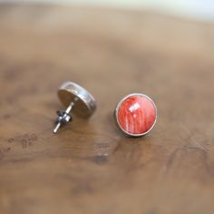 The perfect pair of Spiny Oyster Post Earrings for that pop of color - red/orange Spiny Oyster Simple Post Earrings Posts are a staple of the jewelry wardrobe, and these Beautiful, Sterling Silver, orangy-red Spiny Oyster Posts will be a favorite pair!! These posts are big, natural, high-grade, Spiny Oyster (10mm), simply, bezel set in .925 sterling silver. The big size of the stones gives these earrings a real and easy-to-wear presence. All traditional silversmithing is done in my Baltimore, MD Nickel-free Red Earrings For Everyday, Red Nickel-free Earrings For Everyday Wear, Red Sterling Silver Earrings For Everyday, Red Jewelry With Matching Earrings For Everyday, Red Hypoallergenic Earrings For Everyday Wear, Red Everyday Earrings, Coral Earrings For Gift, Red Creek Jasper, Jewelry Wardrobe