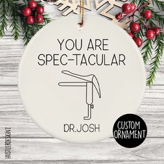 a ceramic ornament with the words you are spec - tacular on it