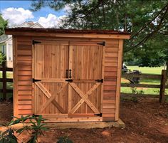 lean to cedar storage shed with double door entry Wooden Double Door, Garden Shed Kits, Cedar Shed, Wood Storage Shed, Wooden Storage Sheds, Wooden Double Doors, Outdoor Storage Solutions, Shed Floor, Firewood Shed