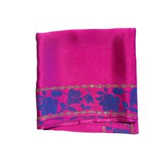 Maharani pink organic peace silk scarf with hand block printed floral motifs on the borders. The motifs have lotus and hibiscus flowers with little stylized leaves.  The base fabric is from a Gots certified peace silk manufacturer, who ensures that the silkworms hatch out of their cocoons as butterflies and complete their natural life cycle.  You can style it to complement various outfits. Wear it as a Bandeau top, or wrap it around your neck as a choker to look fresh and modern throughout the s Pink Unstitched Embroidered Saree, Pink Unstitched Saree With Embroidered Border, Pink Embroidered Border Unstitched Saree, Unstitched Pink Saree With Embroidered Border, Pink Floral Print Silk Scarf, Pink Unstitched Silk Dupatta, Traditional Pink Saree With Block Print, Pink Floral Print Silk Scarves, Pink Silk Scarf With Floral Print