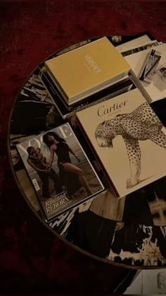 magazines and books on a glass table