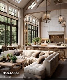 a living room filled with furniture and lots of windows