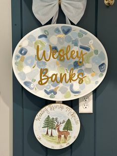 a door hanger with a bow on it that says, westley banks