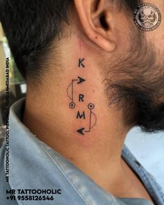 a man with a neck tattoo that says kram and has an arrow on it