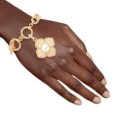 Gold Metal Chain Toggle Bracelet Featuring Cream Pearl Luxury French Designer Inspired Flower Charm. Charm measures 1.5 inches long and 1.25 inches wide. Arm Bracelets, Bridal Gloves, Luxury Bracelet, Color Crema, Wedding Belts, French Designer, Pearl Cream, Toggle Bracelet, Flower Bracelet