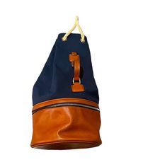 a brown and blue bag hanging from a rope