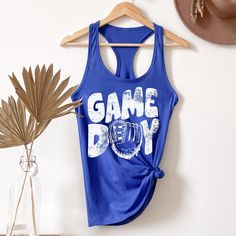 a blue tank top that says game day on it