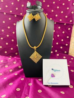 Looking for a piece of traditional temple jewelry that is simple, elegant, and perfect for any occasion? Look no further than this stunning haaram. This necklace is designed with delicate and intricate work by a skilled designer, making it a truly unique and beautiful piece of jewelry. Made with real gold plating, this necklace has the look and feel of a real gold necklace, but at a fraction of the price. It's perfect for anyone who loves traditional temple jewelry or who wants to add a touch of glamour to their outfit. This haaram also comes with matching earrings, making it a complete set that is perfect for any occasion. Wear it to a wedding, festival, or any other special occasion and you're sure to turn heads. But this haaram isn't just for special occasions - it's also perfect for ev 22k Gold Spiritual Jewelry Gift, Traditional Gold Plated Jewelry As Gift, Elegant Brass Jewelry Sets For Festivals, Festive Long Necklace For Gifts, Plated Costume Jewelry Sets For Gifts, Traditional Gold Plated Pendant Jewelry Sets, Gold Plated Pendant Jewelry For Celebration, Traditional Gold Jewelry As A Gift, Traditional Gold Jewelry For Gift