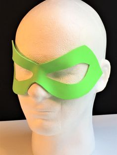 DESCRIPTIONExhale mystical green fire as in your cosplay of Brazilian Beatriz da Costa, alias Green Fury, now know as Fire! Or wear for Ion Green Lantern at Comicon or Halloween. Any shade of green available. Waterproofed leather, glossy or matte finish, & several choices to affix the mask (cord, elastic, ribbon, waterproof cord, stick, or no holes for adhesive). Measurements: 3.25" high x 9.25" wide (tallest & widest points); 2" high between the eyes; 3" wide x 1.5" tall eye openings ---------- Mask Cord, Green Lantern Costume, Justice League Costumes, Superhero Masks, Green Fire, Elastic Ribbon, Leather Mask, Green Lantern, Outdoor Events