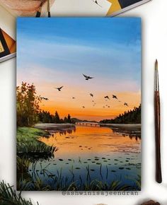 a painting of birds flying over a lake at sunset