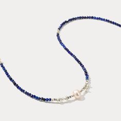 This elegant Blue Seed Bead Necklace is all you need to add a touch of luxe to your ensemble. With its lush navy and pearl beads, it is sure to make a statement. An exquisite upgrade to your jewelry box, it is perfect for those special occasions.   DETAILS Plating: Seed Bead Materials: Seed Bead  Natural  Pearl Measurements: Length: 16.14"(41.0cm) + Extender: 1.57"(4.0cm) Weight: 5.45g Blue Pearl Necklaces With Polished Beads, Blue Pearl Necklace With Polished Beads, Blue Pearl Beaded Necklace With Polished Beads, Elegant Blue Beaded Pearl Necklace, Elegant Blue Pearl Beaded Necklaces, Blue Pearl Beaded Necklaces With Pearl Charm, Elegant Blue Pearl Necklace With Polished Beads, Adjustable Blue Pearl Necklace, Blue Beaded Pearl Necklace