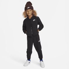 This 2-piece set is an easy way to dress little ones for fun. The hoodie is made of soft fleece for lightweight warmth, has slightly dropped shoulders create a relaxed fit, the full-zip closure makes layering easy and the matching tapered pants have a stretchy waistband for a comfy fit they can play freely in. Pair with any Nike tank or tee for a completed look. Hooded Winter Sweatshirt For Playwear, Winter Hooded Sweatshirt For Playwear, Hooded Hoodie For Playwear In Fall, Winter Fleece Hoodie For Playwear, Casual Drawstring Hoodie For Playwear, Casual Long Sleeve Tracksuit For Playwear, Casual Hoodie With Drawstring Hood For Play, Casual Winter Sweatshirt For Playwear, Casual Cotton Hoodie For Playwear