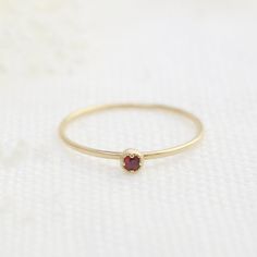 Ruby, July birthstone is set on Envero Jewelry's signature Dahlia setting which has a milgrain around the bezel setting to add elegant and feminine look to this simple ring. Choose from 2 or 3mm natural ruby and solid 14k yellow, rose or white gold. Perfect for simple ruby engagement ring - petite ruby matches perfectly when you wear it with our stack rings. Shop for matching ring: https://www.etsy.com/shop/EnveroJewelry?ref=l2-shopheader-name&section_id=17732059 ♦♦2mm Ruby ring♦♦ :: Small r Elegant Stackable Birthstone Ring, Classic Round Band Lab-created Ruby Jewelry, Classic Lab-created Ruby Round Band Jewelry, Ruby Solitaire Birthstone Ring In Round Cut, Ruby Solitaire Birthstone Ring With Round Cut, Solitaire Ruby Birthstone Ring With Round Cut, Classic Stackable Ruby Ring With Round Cut, Ruby Birthstone Ring In Round Cut, Ruby Solitaire Birthstone Ring With Round Stone