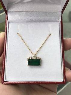 This is a tiara emerald & diamond necklace! This gorgeous piece is sure to get all the right attention! The 2.90ct emerald cut, emerald is nestled in numerous golden prongs. Minor Jardins exist in the emerald as it is natural and earth mined. Five diamonds crown the emerald as they are the ideal tiara. This ring design is custom made by us and is an original JR Colombian Emeralds setting. Setting Style: Tiara Setting Material: 14K Yellow Gold 2.9 Grams Total Carat Weight: 3.30-carats 18 Inch Formal Emerald Necklaces With Single Cut Diamonds, Elegant Green Baguette Cut Necklace, Elegant Green Diamond Necklace In 14k Gold, Baguette Cut Diamond Emerald Necklace For Anniversary, Wedding Emerald Necklace With Brilliant Cut, Exquisite Diamond Emerald Necklace May Birthstone, Emerald Necklace With Single Cut Diamonds For Anniversary, Exquisite Diamond Emerald Necklace For May Birthstone, Emerald Cut Green Diamond Necklace