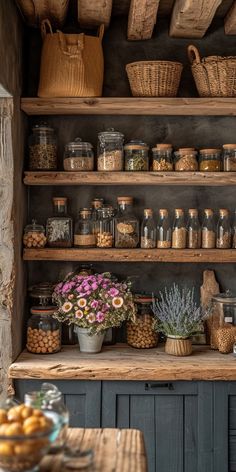 the shelves are filled with many different types of foods and spices, including dried herbs