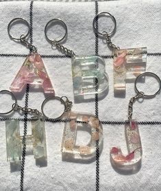 six glass letters are sitting on a towel