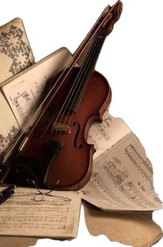 an old violin is laying on top of music sheets