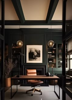 an office with dark green walls and leather chairs in front of a wooden desk surrounded by bookshelves