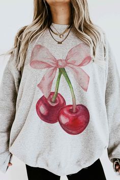 This Cute Cherry Sweatshirt is the perfect gift or outfit for any day. Its trendy, fun and cute for a day out. Soft girl era!!  This Pink ribbon Cherry day be trendy and cozy in our cherry heart with a ribbon sweatshirt.  Q U I C K * F A C T S * ♥️ 100% Soft cotton ♥️Design is high quality digital print ♥️ Wash and dry normally. Do not iron directly on the print. * S I Z I N G * ♥️ Sizing is unisex so runs like men's ♥️Most women find their typical size works best. ♥️ Please see size guide in la Sweet Crew Neck Top For Fall, Sweet Fall Crew Neck Top, Sweet Long Sleeve Cotton Sweatshirt, Cute Crew Neck Sweatshirt For Loungewear, Cute Long Sleeve Spring Sweatshirt, Casual Long Sleeve Top With Cherry Print, Cute Graphic Print Long Sleeve Sweatshirt, Cute Long Sleeve Graphic Print Sweatshirt, Cute Long Sleeve Graphic Sweatshirt