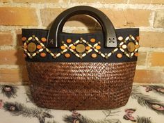 "++ SUN N SAND WOVEN PURSE ++ Beautiful tightly woven purse Wooden beads Wooden arched handle straps It opens up by a magnetic snap clasp to one fully lined main compartment with an extra slip and zipper pocket In wonderful vintage condition ✂ - - - Measurements: height: 9.5\" width: 16\" bottom: 4.5\" strap drop: 2\" Let's be friends! https://www.facebook.com/TheGirlSaidYesVintage 1" Bohemian Brown Straw Bag For Vacation, Bohemian Beaded Beach Bag For Summer, Bohemian Beaded Bags For Vacation, Bohemian Beaded Rectangular Beach Bag, Beaded Beach Bags For Beach Season, Summer Beaded Rectangular Beach Bag, Summer Vacation Beaded Beach Bag, Beaded Natural Color Beach Bag, Beaded Straw Bag For Everyday Summer Use