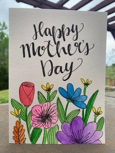 a mother's day card with flowers on it