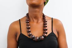 African wooden necklace, Statement Necklace, Wooden Bead Jewelry, Beaded women jewelry, Tribal necklace, Christmas gift for her, Mom's gift An elegant necklace that can compliments any outfit. Handmade by the Maasai women in Kenya using wooden beads. One size fits all. Color: Brown Necklace length: 20 inches 3-5 days delivery via DHL Express.  Pay shipping fee for the first item only and additional items ship for FREE. To view more wooden necklaces in our shop, kindly click here:  https://www.etsy.com/shop/NkoroiCrafts?ref=shop-header-name&listing_id=1295099274&section_id=43662872 Wooden Large Beads Jewelry As Gift, Wooden Beaded Necklace With Round Beads, Wooden Jewelry With Large Round Beads, Traditional Wooden Bead Jewelry, Wooden Beads Necklace Gift, Wooden Beads Round Necklace As Gift, Traditional Wooden Beaded Jewelry, Traditional Wooden Round Bead Jewelry, Traditional Wooden Round Beads Jewelry