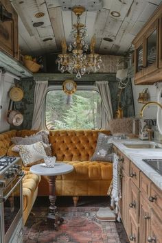 an old bus converted into a tiny home with lots of windows and furniture in it