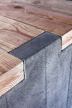 some wood and concrete are stacked together