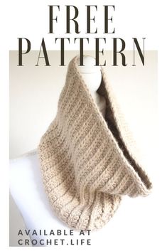 a knitted cowl with the text free pattern available at crochet life