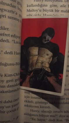 an image of a man with a mask on his face in the pages of a book