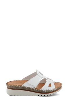 Elevate your look with this platform sandal made with supple leather and designed with cutouts along the sides. 1 3/4" heel Adjustable hook-and-loop strap Cushioned insole Leather upper and lining/synthetic sole Made in Turkey White Sandals With Heel Loop For Vacation, Open Toe Clogs With Removable Insole For Beach, White Beach Sandals With Heel Loop, Beach Sandals With Heel Loop And Open Heel, Leather Clogs With Round Toe For Vacation, Vacation Clogs With Removable Insole, Synthetic Material, Platform Sandals With Single Toe Strap, Vacation Clogs With Removable Insole, Synthetic, Synthetic Platform Sandals With Single Toe Strap