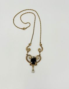 1960's gold-filled filigree and onyx necklace by Ann Lee. Marked Ann Lee 12/20 GF. Delicate design with an oval onyx center and a dangling pear shaped glass stone below, and a filagree link on either side. Very elegant. Vintage Gold Onyx Jewelry, Vintage Onyx Gold Jewelry, Onyx Necklace, Silver Spring, Pear Shaped, Pendant Necklaces, Onyx, Necklace Etsy, Gold Filled