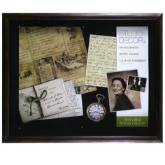 a framed photo with papers, pictures and an alarm clock on it's side