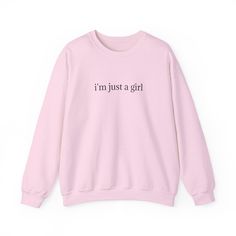 This women's crewneck sweatshirt with the quote 'I'm just a girl' exudes a casual and laid-back vibe, perfect for everyday wear. It is relevant to women who are looking for a cozy and stylish piece to add to their wardrobe. This sweatshirt is suitable for casual outings, lounging at home, or even as a thoughtful gift for birthdays or holidays. Product features - Knit in one piece without side seams for reduced fabric waste - Ribbed knit collar with seam for elasticity and shape retention - Medium-heavy fabric blend of 50% cotton and 50% polyester for coziness - Classic fit and crew neckline for comfort and style - Ethically made with 100% US cotton and low environmental impact dyes Care instructions - Machine wash: cold (max 30C or 90F) - Non-chlorine: bleach as needed - Tumble dry: low he Trendy Long Sleeve Sweater With Text Print, Trendy Winter Text Print Sweatshirt, Pink Cotton Sweater With Text Print, Trendy Winter Sweatshirt With Text Print, Basic Pink Sweatshirt For Fall, Pink Long Sleeve Sweatshirt With Slogan, Pink Long Sleeve Slogan Sweatshirt, Pink Long Sleeve Sweater With Slogan, Pink Cotton Sweater With Slogan