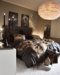 a bedroom with a large bed covered in fur