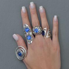 ❀ I made this blue evil eye Ring for you, to make you look elegant. A Long Ring that can fit perfectly to all styles. You will look elegant when you wear this Protection ring. dome evil eye ring stands out with flashy designs. If you have a modern and rebellius style, this luck ring is for you. ❀ It is an Adjustable ring with sterling silver plated matte finish. ❀ All the rings are adjustable in the back. Rings are easy to adjust and would fit fingers size US 4 and up ❀ If you are looking for a Blue Open Ring Metal Jewelry, Blue Open Ring Metal Ring, Blue Metal Open Ring Jewelry, Blue Open Ring Made Of Metal, Trendy Handmade Blue Ring, Trendy Handmade Blue Rings, Elegant Blue Metal Rings, Blue Metal Open Ring, Unique Blue Adjustable Stackable Rings