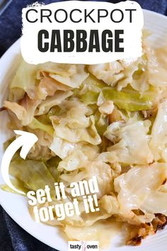 a white plate topped with cabbage covered in gravy