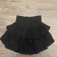 Size Medium Black Ruffle Skirt From Local Boutique-Never Worn Perfect Condition Super Cute Just Doesn't Fit Me Black Fluffy Skirt, Black Stretch Tiered Skirt, Elegant Black Tiered Skort, High Waist Black Skirt With Ruffles, Black High Waist Skirt With Ruffles, Casual Black Skort With Ruffles, Black High-waist Skirt With Ruffles, Black Stretch Tiered Skort, Black Fitted Tiered Mini Skirt