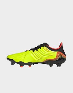 a yellow soccer shoe with black and red accents on the upper part of the shoe