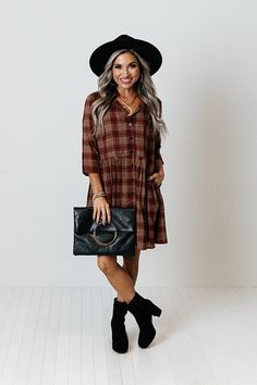 You will surely be in a cherry mood when you wear this charming tunic dress featuring lightweight material patterned with a brown and dark red hued plaid print, a v-cut neckline, loose 3/4-length sleeves, and a relaxed silhouette that falls into a straight mid-thigh length hemline! Measurements S : Bust 44", Hip 50", Length 33", Sleeve Length 15.5", Waist 44". M : Bust 46", Hip 52", Length 33.5", Sleeve Length 16", Waist 46". L : Bust 48", Hip 54", Length 34", Sleeve Length 16", Waist 48". XL : Casual Burgundy Dress For Fall, Long Sleeve Brown Plaid Dress For Fall, Casual Brown Plaid Dress For Fall, Fall Plaid V-neck Dress, Plaid Tunic Dress, Plaid Tunic, Plaid Jacket, Model Fits, V Cut