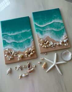 two canvases with seashells and starfish on them sitting next to each other