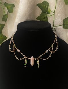 This choker is a unique, one-of-a-kind creation made with love and care! This one of a kind layered choker is inspired by the idea of a "fairy garden" with the colors of a garden in mind: pink and purple flowers, green leaves, and clear, shiny dew. This choker is made with a hand-wrapped genuine agate crystal pendant and a variety of crystal beads and glass beads. Please keep in mind that not all of the beads are crystals, as some are glass. All details on the choker are listed below. *Please lo Mystical Handmade Adjustable Beaded Necklace, Handmade Adjustable Mystical Beaded Necklaces, Handmade Adjustable Mystical Beaded Necklace, Handmade Fairycore Festival Necklaces, Handmade Fairycore Necklaces For Festivals, Handmade Whimsical Choker Necklace, Whimsical Handmade Choker Necklace, Fairycore Adjustable Beaded Necklaces, Adjustable Beaded Fairycore Necklace