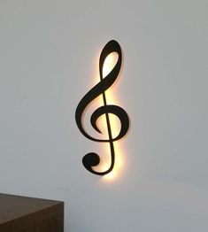 a metal treble hanging from the side of a wall