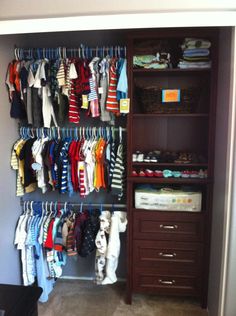 the closet is full of baby clothes and other things to wear in it for storage