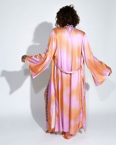 Embrace vibrant elegance with our long kimono and satin pants set. The kimono pairs beautifully with the fluidity of the satin pants, both adorned with a lively pink and orange abstract tie-dye print. Together, they offer a harmonious blend of bohemian charm and contemporary style. Fashion Forward Outfits, Satin Set, Satin Pants, Long Kimono, Pink Tie Dye, Pink Ties, Tie Dye Print, The Chic, Kimonos