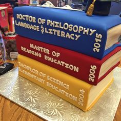 a stack of books sitting on top of a table